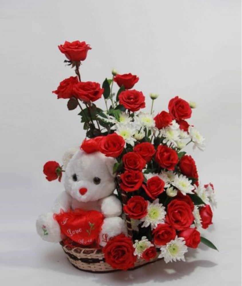 Teddy( 6 inches) in the same Basket with 18 RedRoses and 6 white Gerberas