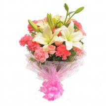 Pink carnations surrounding white Lilies