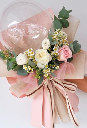 6 White and Pink Roses added with foliage on the outside of a printed happy birthday balloon bouquet with pink ribbons and pink paper