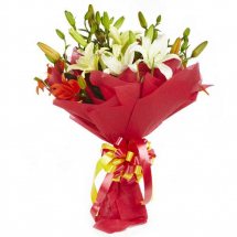 White Asiatic Lilies in red wrapping