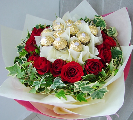 12 Red roses with 16 Ferrero chocolates in same bouquet