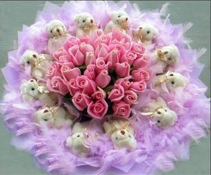 Bouquet of 12 pink roses surrounded by 12 Teddies 6 inches each